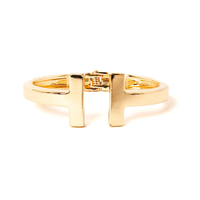 The gold Honey Cuff Bangle with T shaped ends and a hinge fastening for easy wear